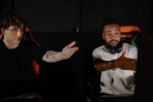 Two men intensely gaming, showcasing teamwork and strategy in a competitive online session. — Find The Best Online Casino - P