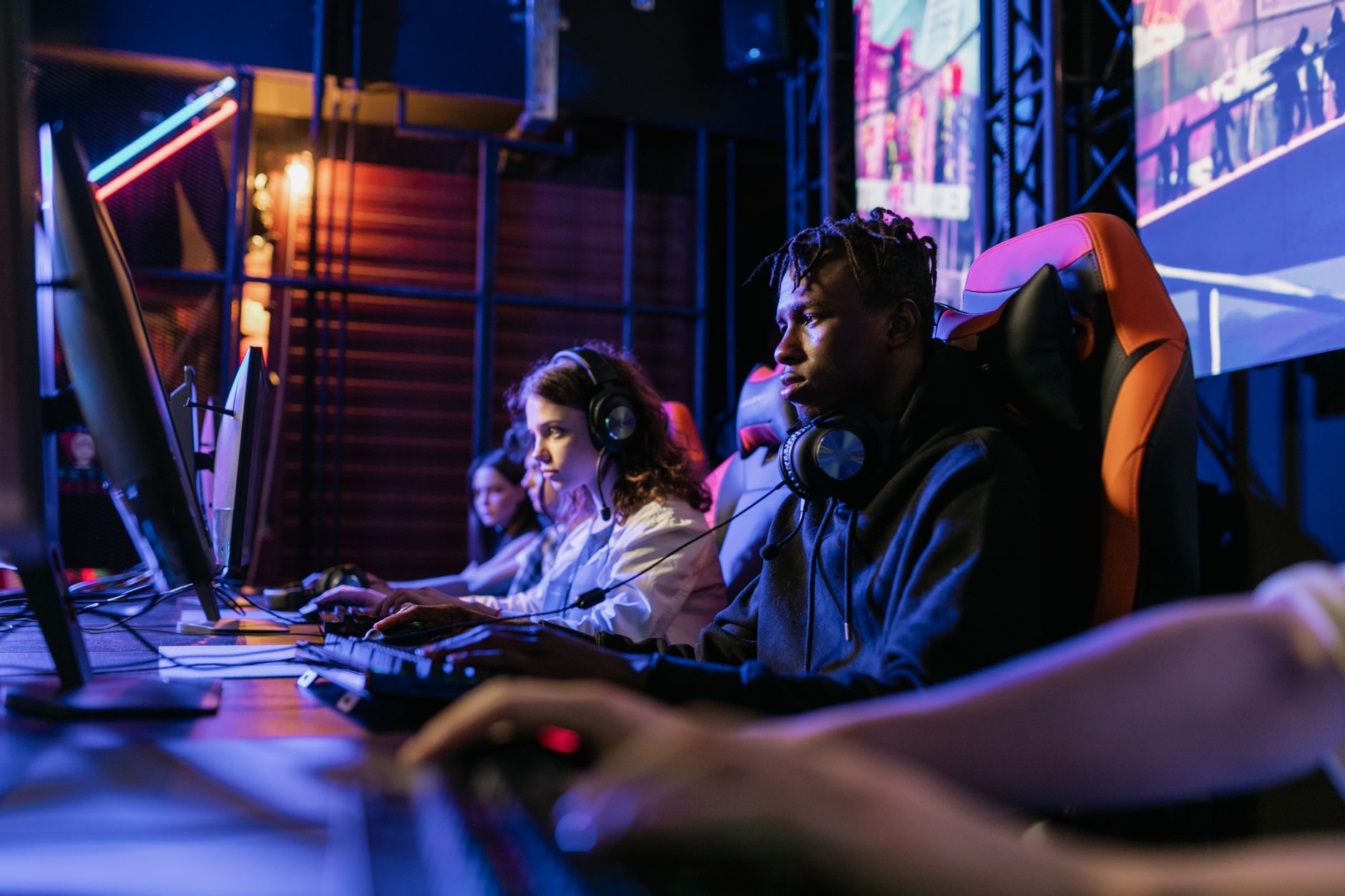 Serious gamers engage in a competitive esports event, highlighting focus and teamwork. — What are some other popular casino g
