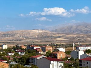 A picturesque view of Kovancılar, Elazığ with red-roofed houses and mountain landscape. — Why Playing in provably fair casino