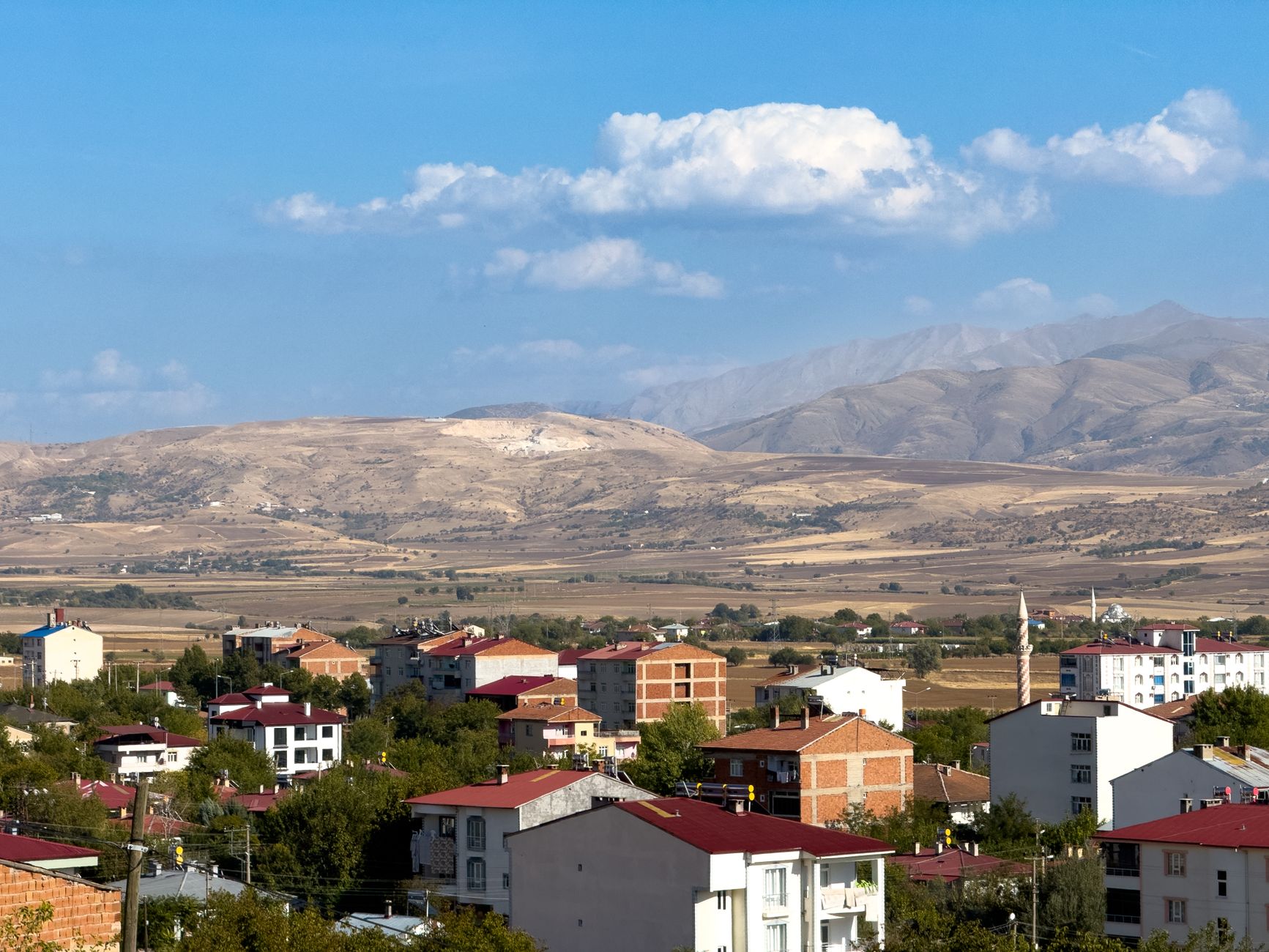 A picturesque view of Kovancılar, Elazığ with red-roofed houses and mountain landscape. — Why Playing in provably fair casino